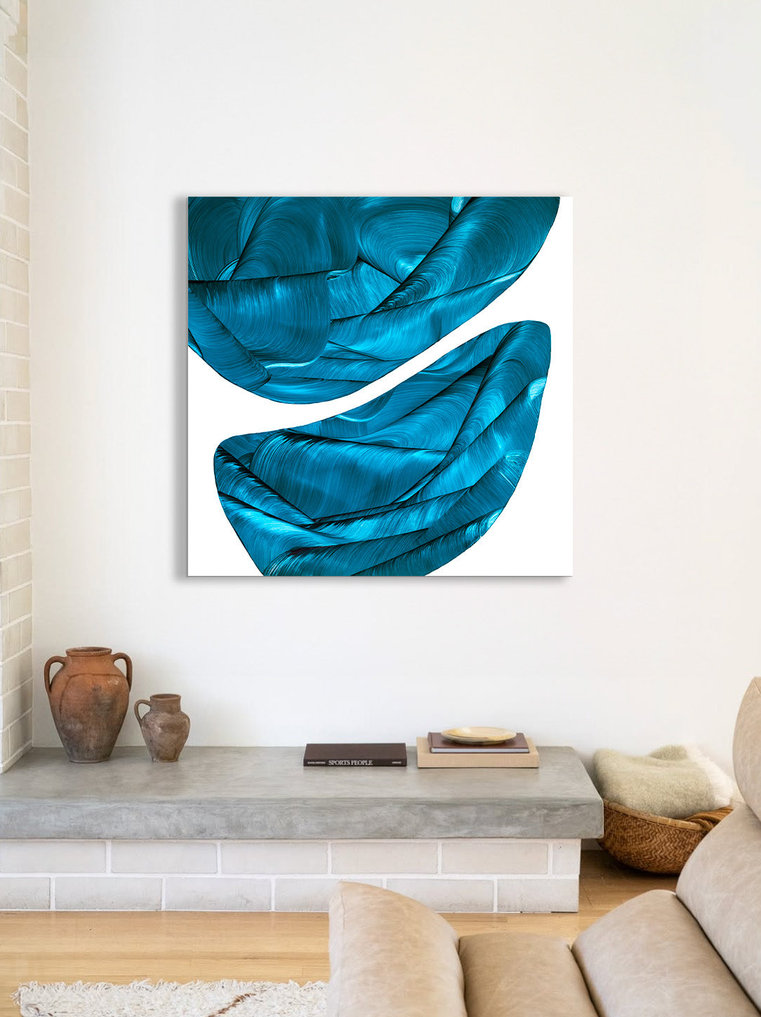 Blue abstract painting on a white wall above a console table in a living room.