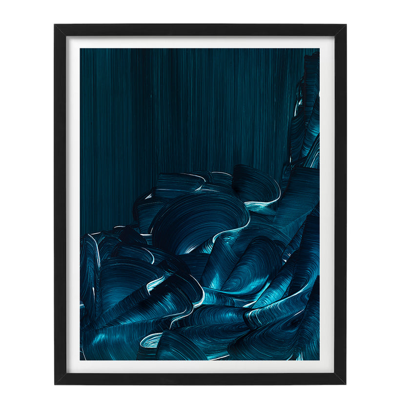 Framed artwork of blue abstract sea waves on a dark blue background