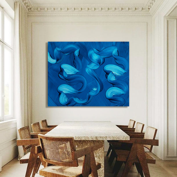 Dining room with a large blue ocean abstract painting on the wall above a marble table.